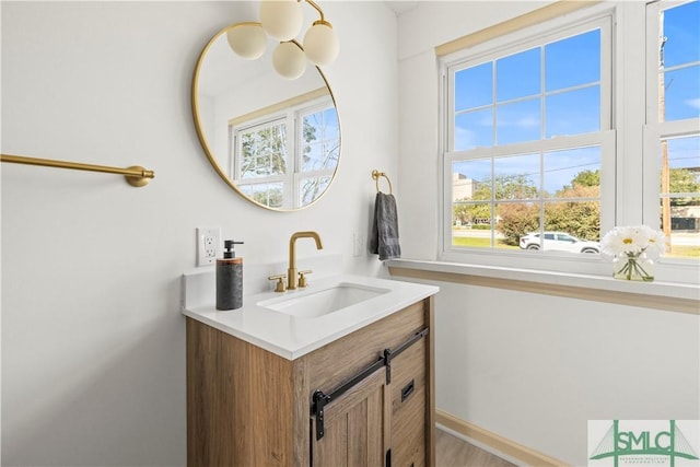 bathroom featuring vanity and baseboards