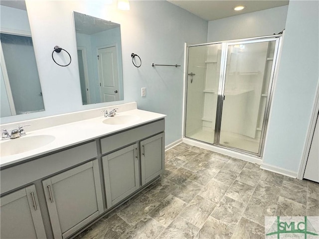 bathroom featuring vanity and a shower with shower door