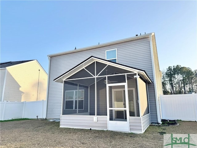 rear view of house with a sunroom