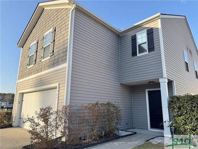 view of front of property with a garage