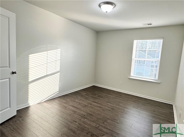 unfurnished bedroom with dark hardwood / wood-style floors