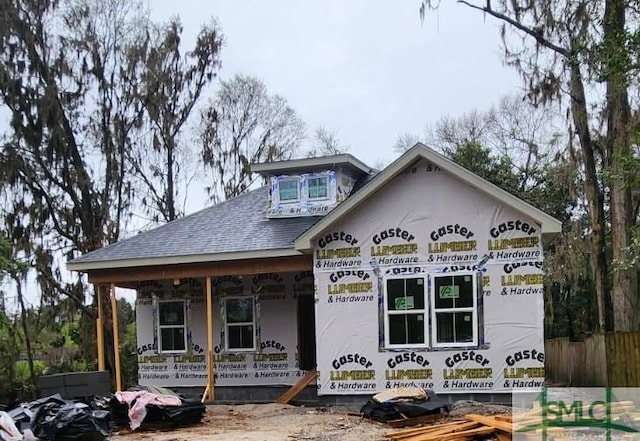 unfinished property featuring covered porch