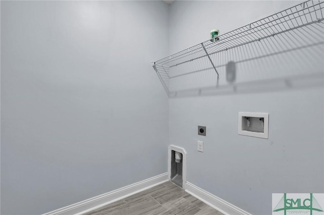 laundry area featuring wood-type flooring, hookup for an electric dryer, and hookup for a washing machine