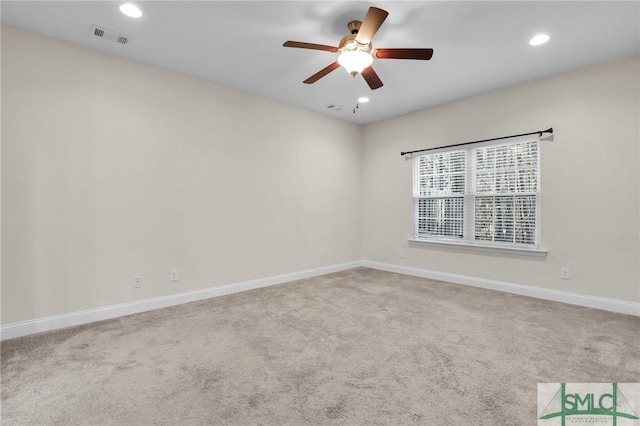 carpeted empty room with ceiling fan