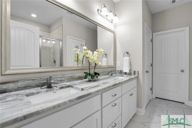 bathroom featuring an enclosed shower and vanity