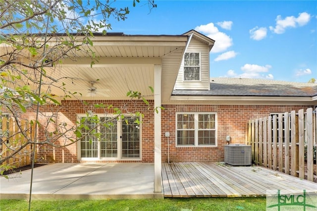 exterior space with a wooden deck, central AC unit, ceiling fan, and a patio