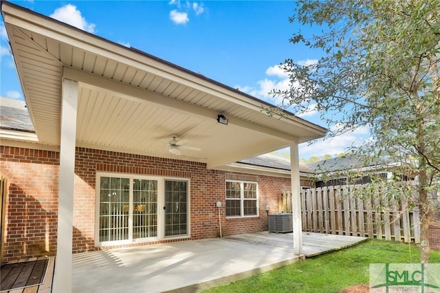 view of patio featuring cooling unit, ceiling fan, and a deck