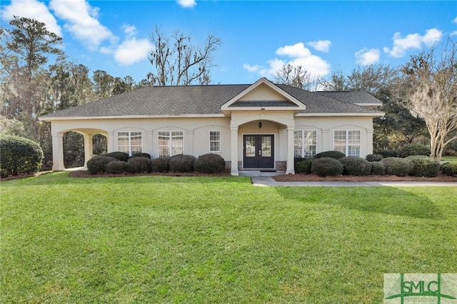 ranch-style home featuring french doors and a front lawn