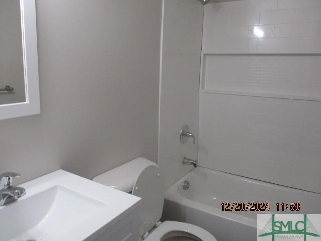 full bathroom with shower / bathing tub combination, sink, and toilet