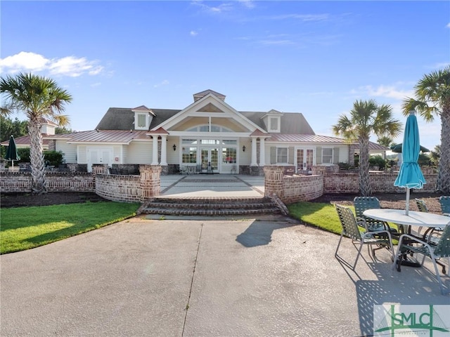 back of house featuring french doors, a yard, and a patio area