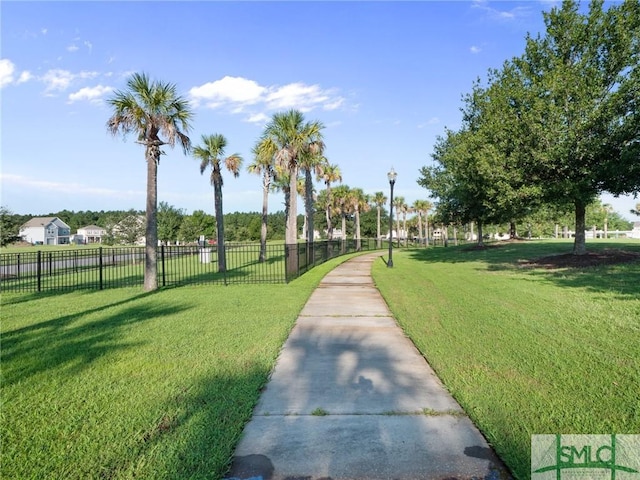 view of property's community with a yard