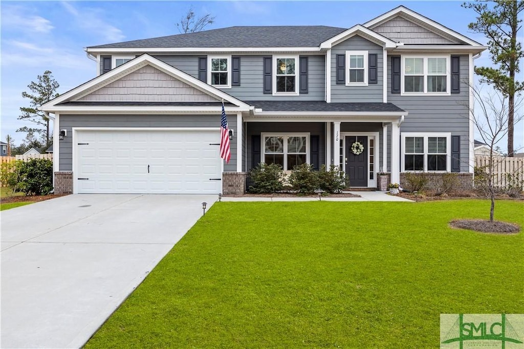 craftsman-style home with a garage and a front yard