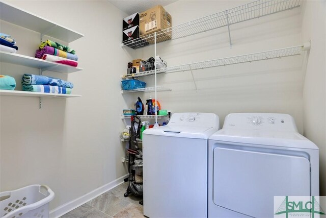216 Olde Towne Rd, Savannah, GA 31410 - laundry area featuring washer and clothes dryer and baseboards