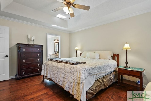 216 Olde Towne Rd, Savannah, GA 31410 - bedroom featuring a raised ceiling, dark wood finished floors, ornamental molding, and ceiling fan