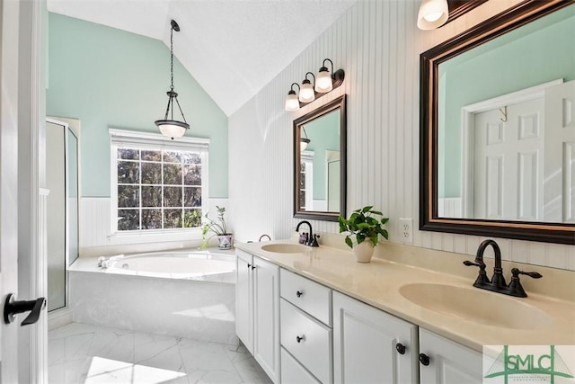 216 Olde Towne Rd, Savannah, GA 31410 - bathroom with lofted ceiling, a garden tub, marble finish flooring, double vanity, and a stall shower