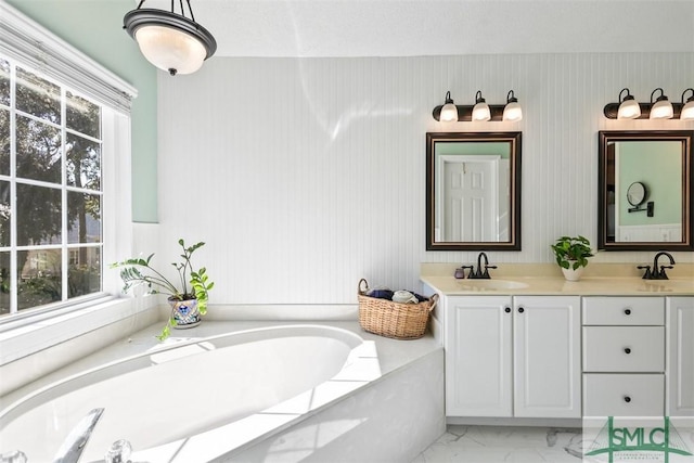 216 Olde Towne Rd, Savannah, GA 31410 - bathroom featuring a bath, double vanity, and marble finish floors