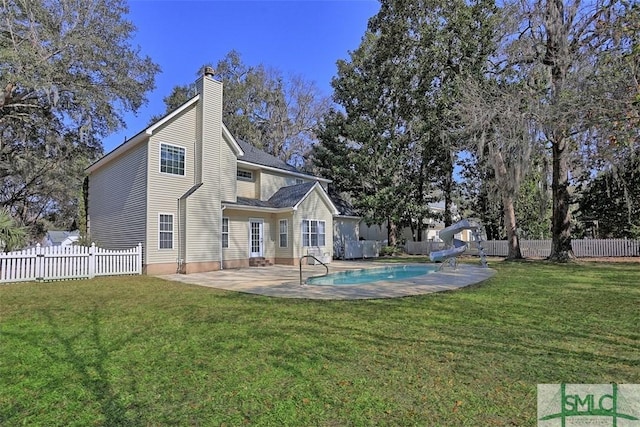 216 Olde Towne Rd, Savannah, GA 31410 - back of property with a patio area and a chimney