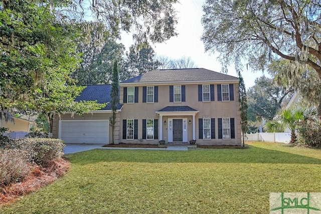 216 Olde Towne Rd, Savannah, GA 31410 - colonial inspired home featuring an attached garage, driveway, and a shingled roof