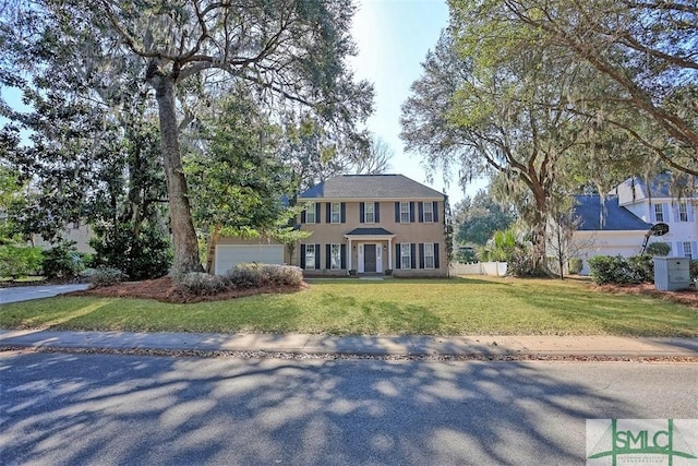 216 Olde Towne Rd, Savannah, GA 31410 - colonial home with a garage and stucco siding