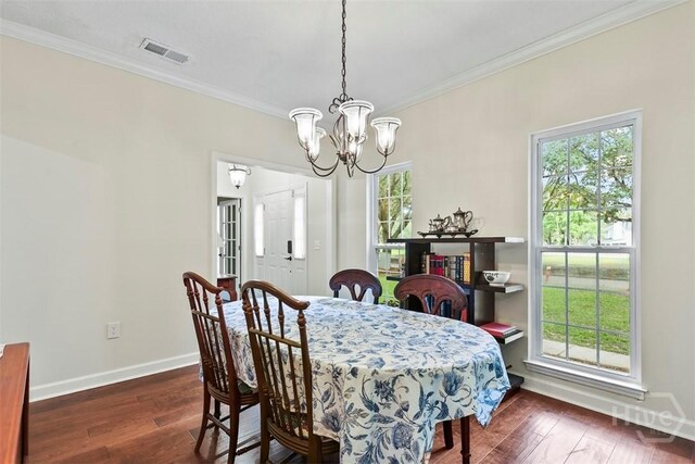 216 Olde Towne Rd, Savannah, GA 31410 - dining area with a chandelier, baseboards, ornamental molding, and wood-type flooring