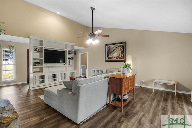 living room featuring dark wood-type flooring, ceiling fan, and vaulted ceiling