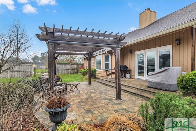 view of patio / terrace featuring a grill and a pergola