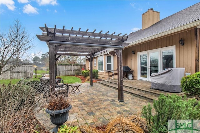 view of patio / terrace featuring area for grilling and a pergola