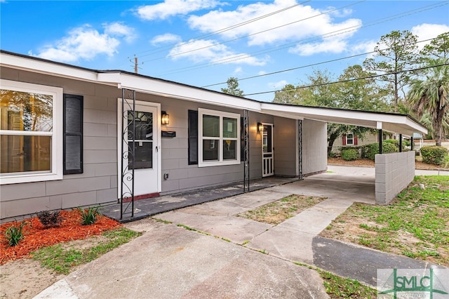 view of front of home with a carport