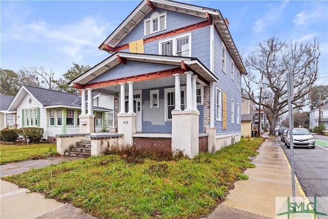 view of front of property featuring covered porch