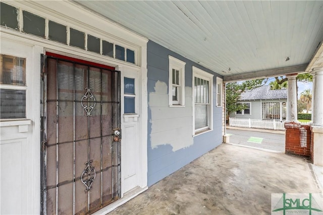 entrance to property featuring a porch