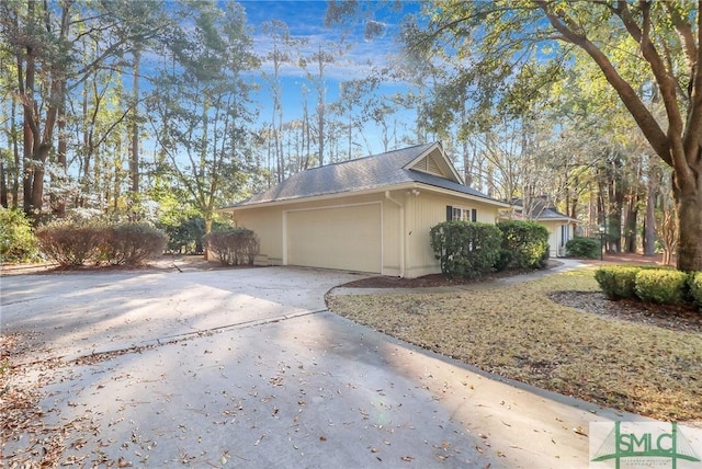 view of side of property with a garage