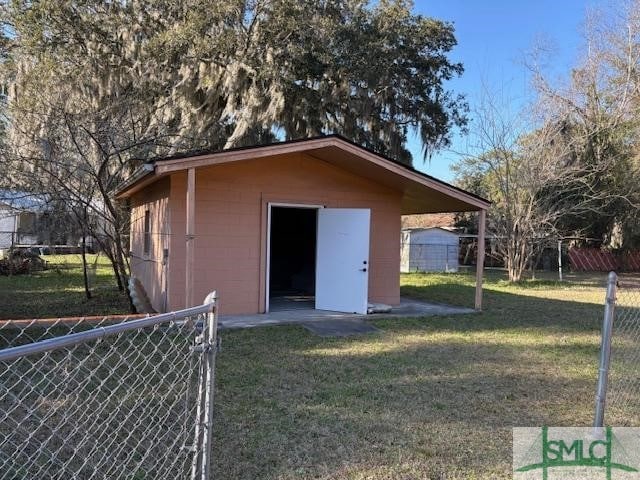 view of outdoor structure with a yard