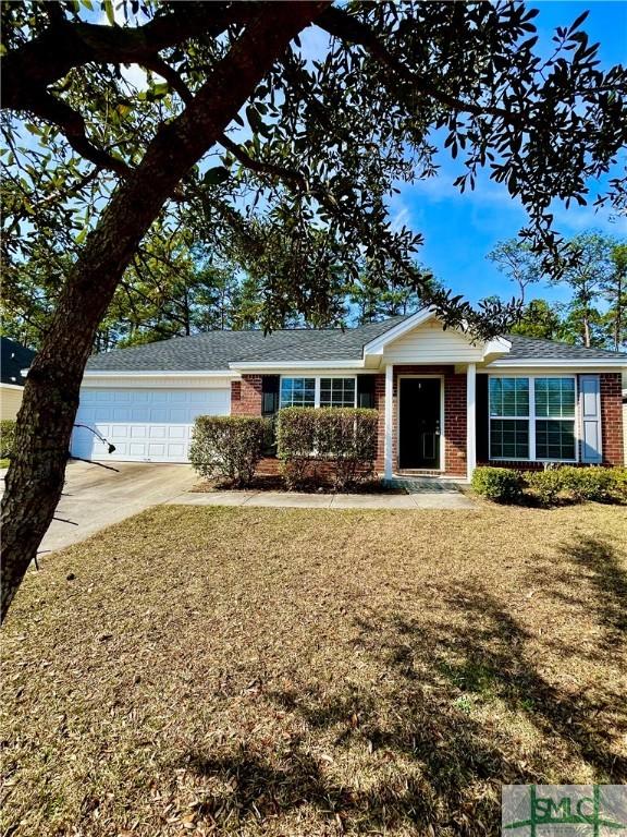 single story home with a garage and a front yard