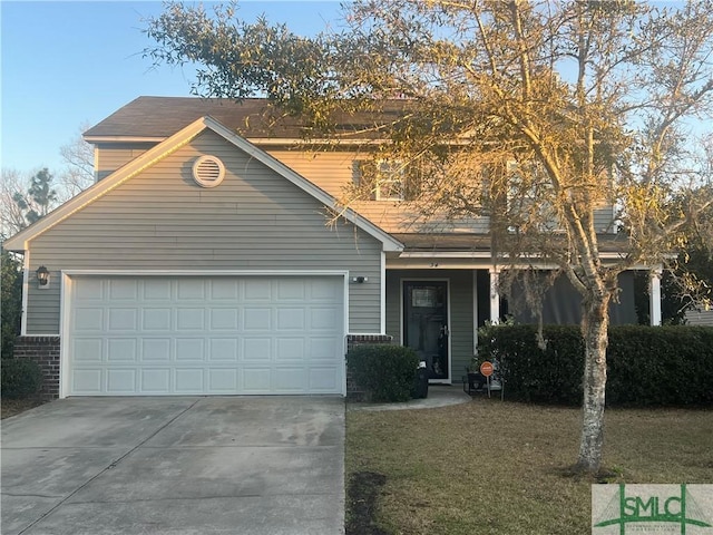 front facade featuring a front lawn and a garage