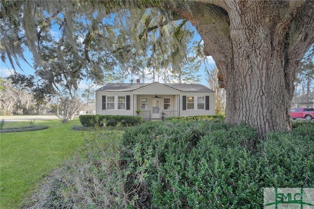 single story home with covered porch and a front lawn