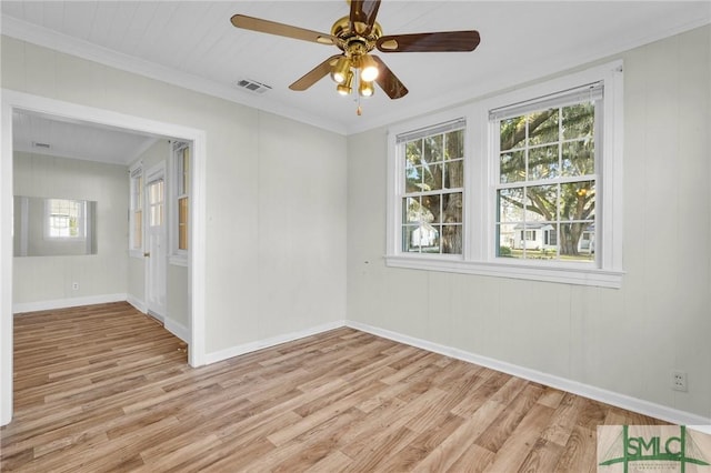 spare room featuring ceiling fan, light hardwood / wood-style flooring, and crown molding