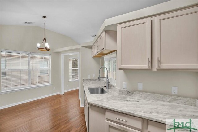 209 Mariners Way, Savannah, GA 31419 - kitchen featuring a sink, lofted ceiling, a chandelier, wood finished floors, and pendant lighting
