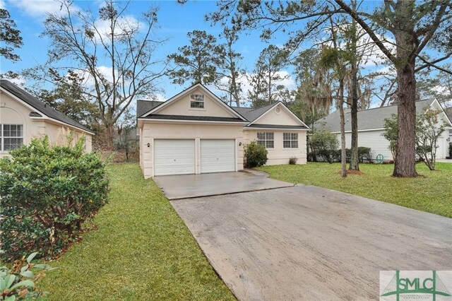 209 Mariners Way, Savannah, GA 31419 - view of front facade featuring concrete driveway, a front lawn, stucco siding, and an attached garage