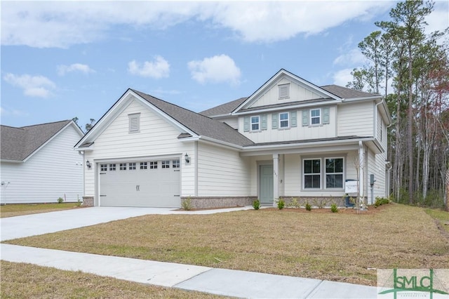 view of front facade featuring driveway, an attached garage, board and batten siding, and a front yard