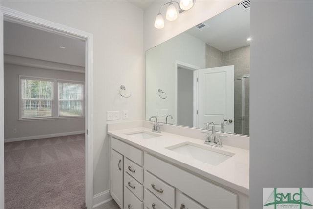 full bathroom featuring double vanity, visible vents, and a sink