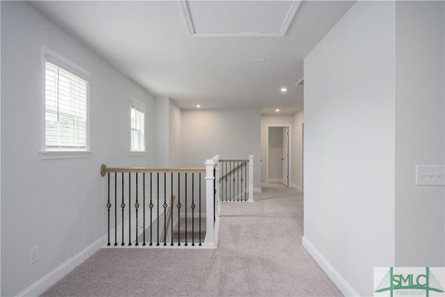 hall featuring recessed lighting, baseboards, an upstairs landing, and carpet floors