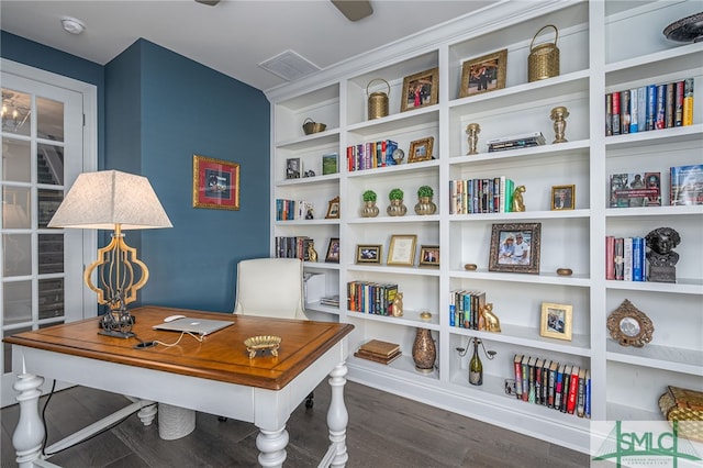 office featuring dark wood-type flooring and built in shelves