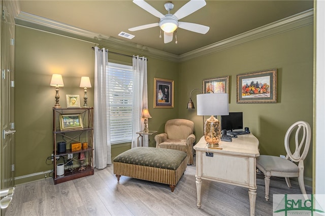 home office with ceiling fan, light hardwood / wood-style flooring, and crown molding