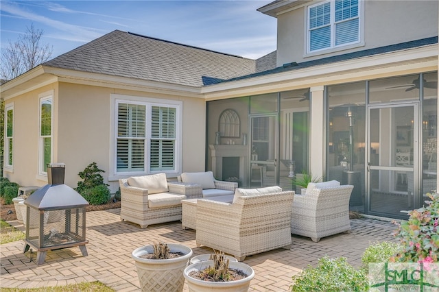 view of patio / terrace with outdoor lounge area and a sunroom