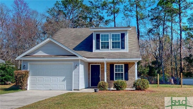 view of front of home featuring a front yard and a garage