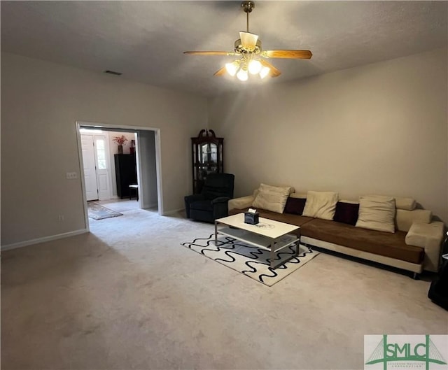 unfurnished living room with ceiling fan and light colored carpet