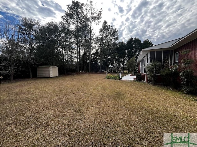 view of yard with a storage unit and a sunroom