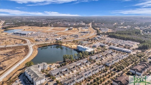 drone / aerial view with a water view