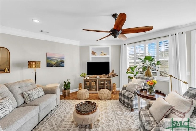 living room with ceiling fan, crown molding, and hardwood / wood-style floors