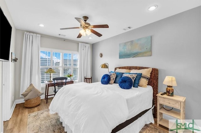 bedroom featuring ceiling fan and light hardwood / wood-style flooring